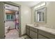 Bathroom featuring a sink with vanity, window and a separate toilet and shower room at 1050 Mountain Creek Trl, Atlanta, GA 30328