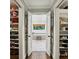 Luxurious bathroom entrance through walk in closets featuring a soaking tub with lovely natural light at 1050 Mountain Creek Trl, Atlanta, GA 30328