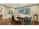 Stylish dining room with a wooden table, unique lighting, and hardwood floors at 1050 Mountain Creek Trl, Atlanta, GA 30328