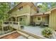 The home features a spacious deck overlooking the natural surroundings of the property at 1050 Mountain Creek Trl, Atlanta, GA 30328