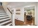 Entryway with stairs, coat hooks, hardwood floors, and access to dining room at 1050 Mountain Creek Trl, Atlanta, GA 30328