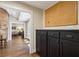 Hallway with custom black cabinets leads to spacious kitchen and cozy living room at 1050 Mountain Creek Trl, Atlanta, GA 30328