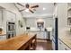 Bright kitchen with stainless steel appliances, double ovens, large island and white cabinets at 1050 Mountain Creek Trl, Atlanta, GA 30328