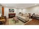 Cozy living room with a piano, comfortable seating, and hardwood floors at 1050 Mountain Creek Trl, Atlanta, GA 30328