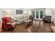 Open living room with comfortable seating, hardwood floors, and outdoor access at 1050 Mountain Creek Trl, Atlanta, GA 30328