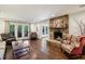 Cozy living room with a stone fireplace and French doors to the exterior at 1050 Mountain Creek Trl, Atlanta, GA 30328