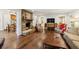 Inviting living room features a stone fireplace, hardwood floors and comfortable seating arrangement at 1050 Mountain Creek Trl, Atlanta, GA 30328