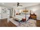 Spacious main bedroom with a four-poster bed, ceiling fan, and an ensuite bathroom at 1050 Mountain Creek Trl, Atlanta, GA 30328