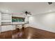 Office with built-in desks and shelving, a ceiling fan and natural light from large window at 1050 Mountain Creek Trl, Atlanta, GA 30328