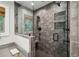 Elegant tiled walk-in shower with glass door and window for natural light and rainfall shower head at 1050 Mountain Creek Trl, Atlanta, GA 30328