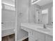 Modern bathroom with bright vanity and sink, complemented by wood-look flooring at 110 Village Green Cir, Tyrone, GA 30290