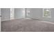 Bright bedroom with neutral carpet and bright windows at 110 Village Green Cir, Tyrone, GA 30290