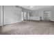 Spacious bedroom with plush carpeting and serene gray walls at 110 Village Green Cir, Tyrone, GA 30290