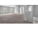 Large bedroom with neutral carpet, bright windows, and vaulted ceilings at 110 Village Green Cir, Tyrone, GA 30290