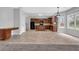 Well-equipped kitchen with dark wood cabinets, a central island, and modern appliances at 110 Village Green Cir, Tyrone, GA 30290