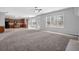 Spacious living room features an open floor plan and seamlessly connects to the kitchen at 110 Village Green Cir, Tyrone, GA 30290