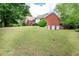 Well-kept backyard with a gradual incline, highlighting the brick exterior and potential for outdoor enjoyment at 1510 Pecan Plantation Ct, Loganville, GA 30052