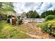 Backyard featuring a well-maintained lawn, pool, and manicured landscaping at 1510 Pecan Plantation Ct, Loganville, GA 30052