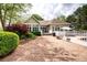 Paver patio leading to the home's rear entrance, poolside, and outdoor grill at 1510 Pecan Plantation Ct, Loganville, GA 30052