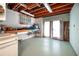 Unfinished basement with exposed ceiling, pegboard, and french doors at 1510 Pecan Plantation Ct, Loganville, GA 30052