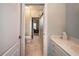 This bathroom has tile floor and glass shower at 1510 Pecan Plantation Ct, Loganville, GA 30052