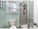 This bathroom has light green walls and a glass shower at 1510 Pecan Plantation Ct, Loganville, GA 30052