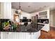 Spacious kitchen with granite countertops, white cabinets, and stainless steel appliances at 1510 Pecan Plantation Ct, Loganville, GA 30052