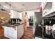 Bright kitchen features granite countertops, white cabinets, and stainless steel appliances at 1510 Pecan Plantation Ct, Loganville, GA 30052