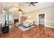 Bright living room with hardwood floors, a fireplace, and ample natural light at 1510 Pecan Plantation Ct, Loganville, GA 30052