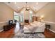 Inviting living room featuring hardwood floors, fireplace and vaulted ceiling at 1510 Pecan Plantation Ct, Loganville, GA 30052