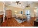 Large living room with hardwood floors, fireplace and vaulted ceiling at 1510 Pecan Plantation Ct, Loganville, GA 30052