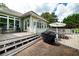 Outdoor patio with seating and grilling area next to an in-ground pool at 1510 Pecan Plantation Ct, Loganville, GA 30052