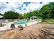 View of the in-ground pool and gazebo surrounded by white fencing at 1510 Pecan Plantation Ct, Loganville, GA 30052