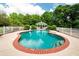 In-ground pool with brick trim and steps, along with fenced gazebo at 1510 Pecan Plantation Ct, Loganville, GA 30052