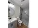 Bathroom with a new vanity, toilet, and a shower with decorative tile at 4074 Green Hawk Trl, Decatur, GA 30035