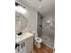 Modern bathroom with stylish vanity, sleek fixtures, and a walk-in shower with gray tile at 4074 Green Hawk Trl, Decatur, GA 30035