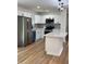 Modern kitchen featuring white cabinets, stainless steel appliances, and a kitchen island at 4074 Green Hawk Trl, Decatur, GA 30035