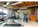 Unfinished basement area perfect for a home gym, complete with workout equipment at 4344 White Surrey Nw Dr, Kennesaw, GA 30144