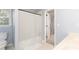 Bathroom showcasing a shower-tub combo and easy access to the bedroom at 4344 White Surrey Nw Dr, Kennesaw, GA 30144