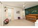 Charming bedroom features a ceiling fan and lovely wall decor at 4344 White Surrey Nw Dr, Kennesaw, GA 30144