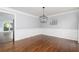 Traditional dining room with white wainscoting and hardwood floors at 4344 White Surrey Nw Dr, Kennesaw, GA 30144