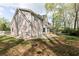 Exterior side view of a two story home showing a patio and backyard at 4344 White Surrey Nw Dr, Kennesaw, GA 30144