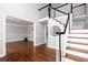 Bright foyer with hardwood floors and classic staircase at 4344 White Surrey Nw Dr, Kennesaw, GA 30144