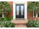Elegant front door with diamond pane glass and manicured landscaping at 4344 White Surrey Nw Dr, Kennesaw, GA 30144