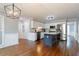 Bright kitchen with white cabinets, stainless steel appliances, a central island, and hardwood flooring at 4344 White Surrey Nw Dr, Kennesaw, GA 30144