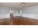 Spacious living area with hardwood floors offering entrances to other parts of the house at 4344 White Surrey Nw Dr, Kennesaw, GA 30144