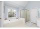 Bright main bathroom with a large soaking tub, shower, and natural light at 4344 White Surrey Nw Dr, Kennesaw, GA 30144
