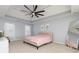 Spacious main bedroom with a tray ceiling, fan, neutral walls, and plush carpeting at 4344 White Surrey Nw Dr, Kennesaw, GA 30144