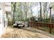 Wooden patio area with a wicker outdoor seating set perfect for entertaining at 4344 White Surrey Nw Dr, Kennesaw, GA 30144