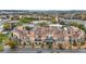 Aerial view of luxury brick and stone townhomes with rooftop decks in a vibrant neighborhood at 1199 Huff Nw Rd # 112, Atlanta, GA 30318
